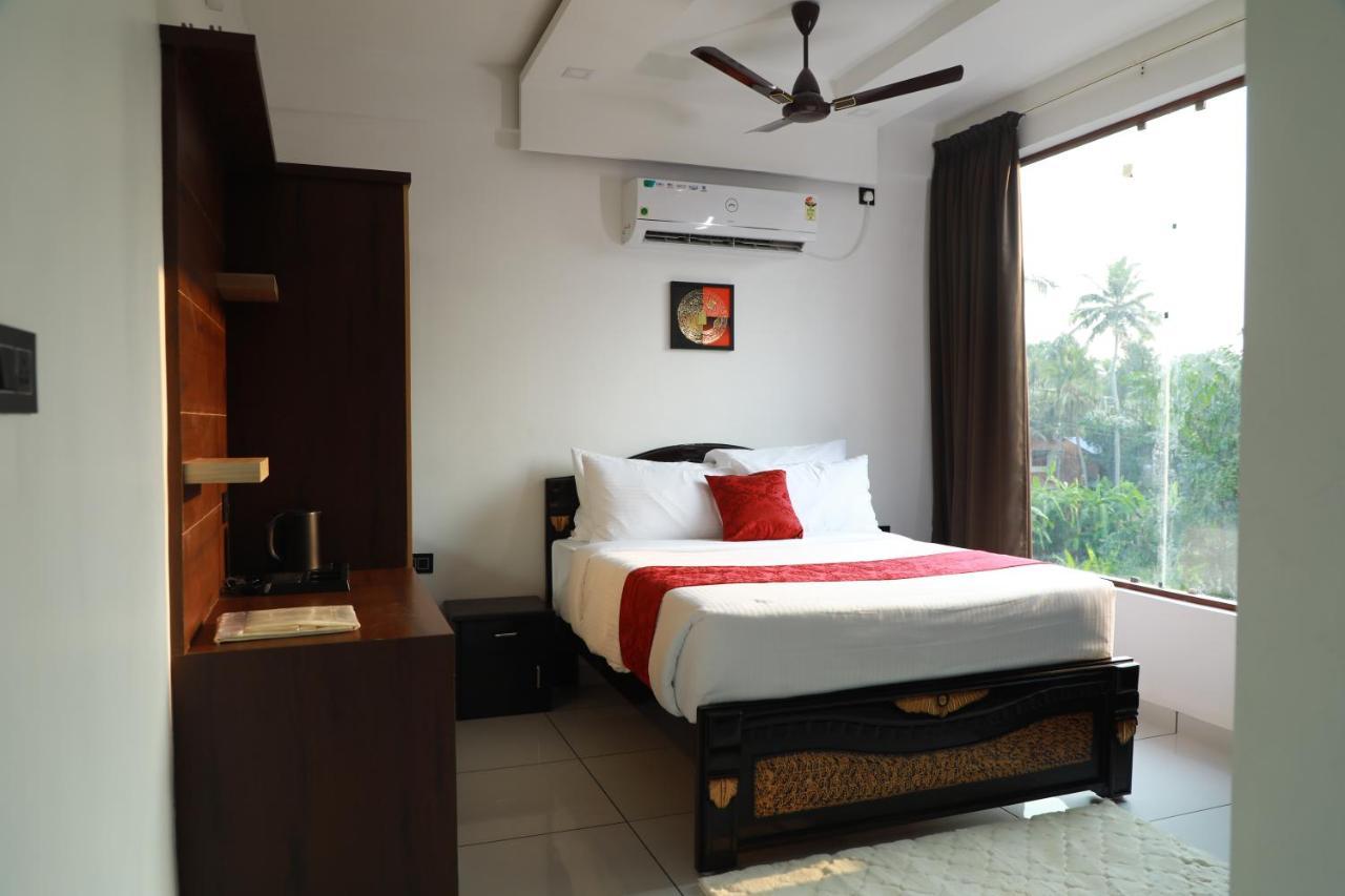 Hotel Achoos Residency Tiruvalla Esterno foto